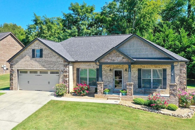 craftsman inspired home featuring a garage, a porch, and a front lawn