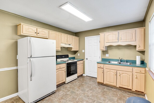 kitchen with light brown cabinets, white appliances, and sink