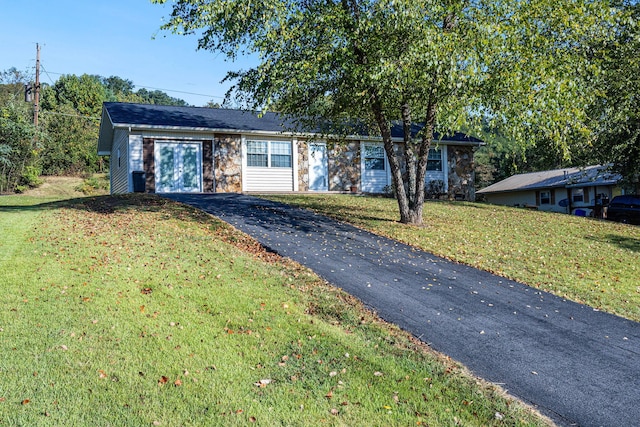 ranch-style home with a front yard