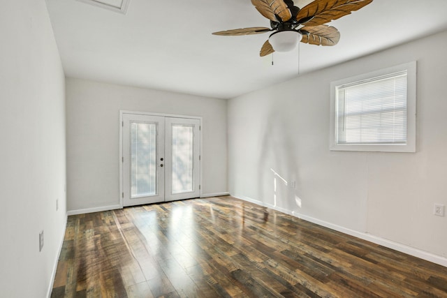 spare room with french doors, dark hardwood / wood-style flooring, ceiling fan, and a healthy amount of sunlight