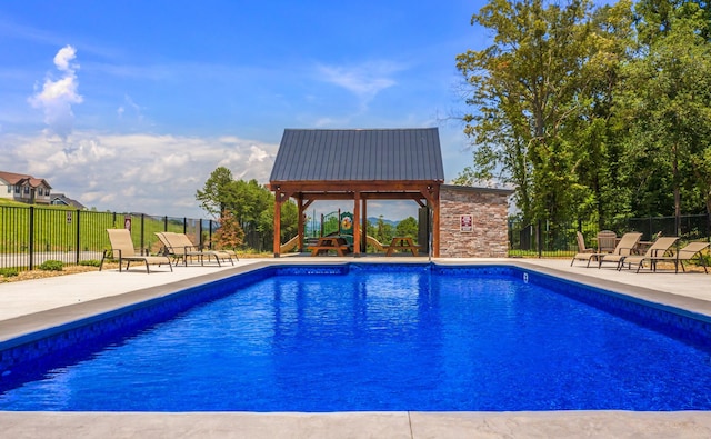 view of pool with a fenced in pool, a patio area, and fence