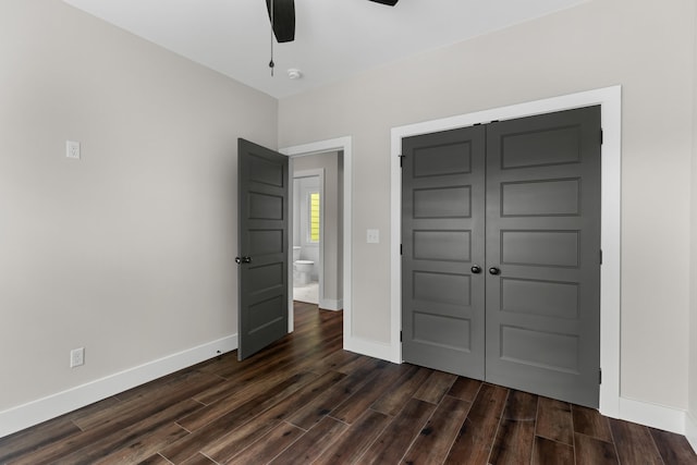 270A W Main St, Dandridge, TN 37725 - unfurnished bedroom with dark wood-style floors, baseboards, a closet, and a ceiling fan