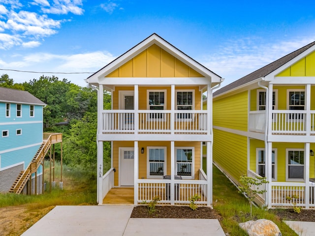 270A W Main St, Dandridge, TN 37725 - view of front of house featuring covered porch, board and batten siding, and a balcony