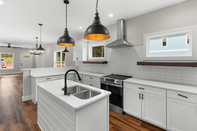 270A W Main St, Dandridge, TN 37725 - kitchen featuring stainless steel range with electric stovetop, wall chimney exhaust hood, a sink, a peninsula, and backsplash