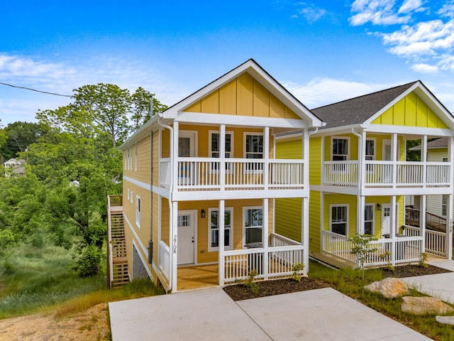 270A W Main St, Dandridge, TN 37725 - view of property with board and batten siding, covered porch, and a balcony