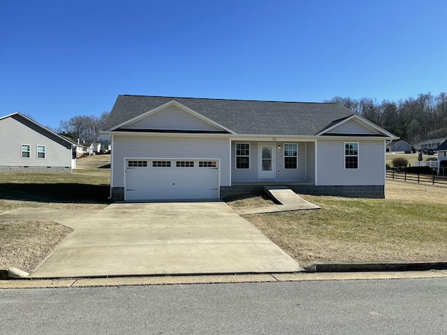 single story home with a garage and a front lawn