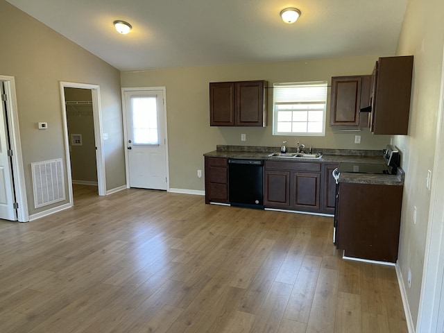 kitchen with a healthy amount of sunlight, black dishwasher, sink, and range