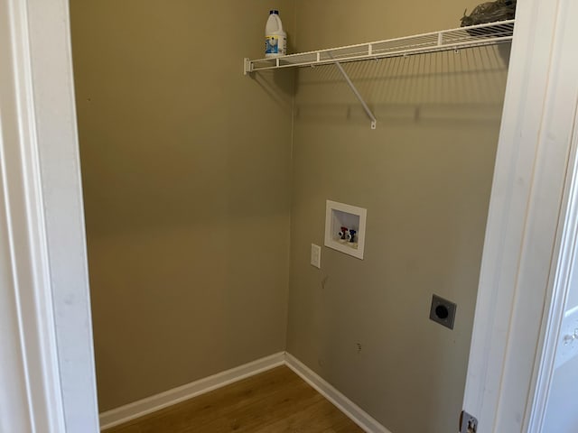 clothes washing area featuring washer hookup, hardwood / wood-style flooring, and hookup for an electric dryer