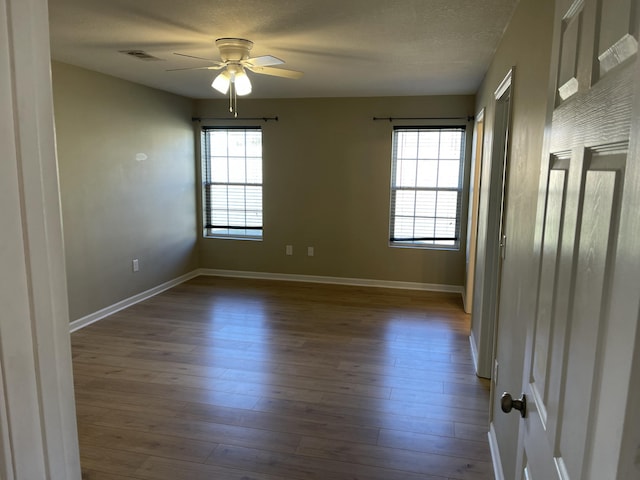 unfurnished room with hardwood / wood-style floors, a textured ceiling, and ceiling fan