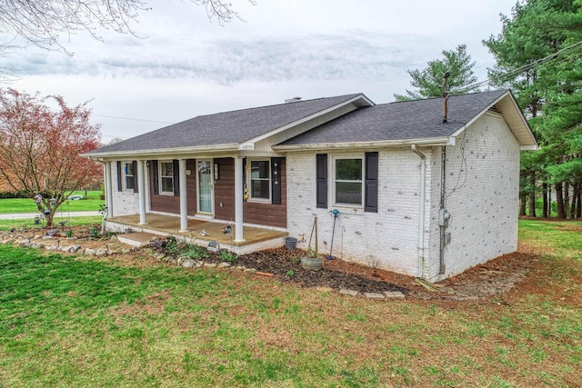 506 Viola Cir, Mount Carmel, TN 37645 - ranch-style home with a front yard, a porch, brick siding, and roof with shingles