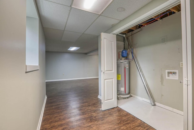 506 Viola Cir, Mount Carmel, TN 37645 - finished below grade area with baseboards, electric water heater, a drop ceiling, and wood finished floors