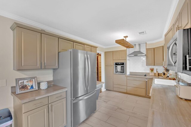 2306 Mountain Dr, Kingsport, TN 37664 - kitchen featuring wall chimney range hood, stainless steel appliances, light countertops, crown molding, and a sink