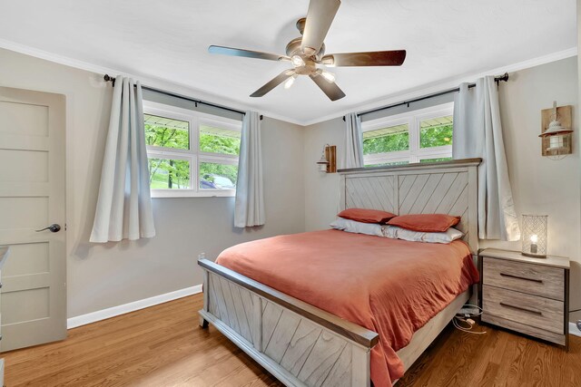 2306 Mountain Dr, Kingsport, TN 37664 - bedroom featuring light wood finished floors, baseboards, crown molding, and a ceiling fan