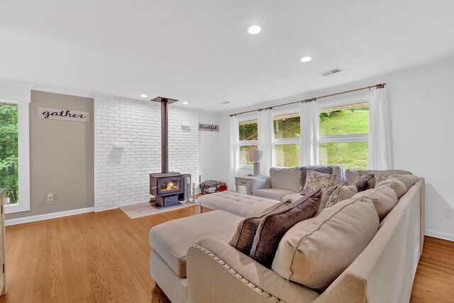2306 Mountain Dr, Kingsport, TN 37664 - living room with a wood stove, light wood-style floors, recessed lighting, and baseboards