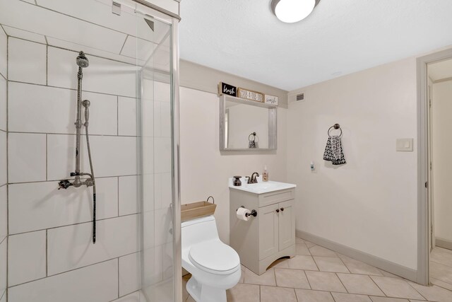 2306 Mountain Dr, Kingsport, TN 37664 - bathroom featuring a stall shower, vanity, toilet, tile patterned flooring, and baseboards