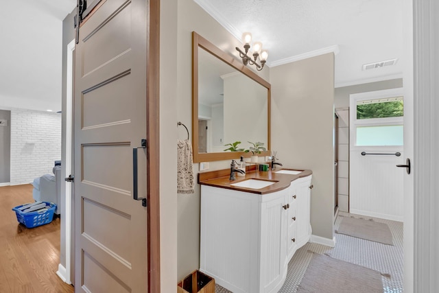 2306 Mountain Dr, Kingsport, TN 37664 - full bathroom featuring double vanity, a shower stall, wood finished floors, ornamental molding, and baseboards