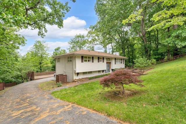 2306 Mountain Dr, Kingsport, TN 37664 - raised ranch with a chimney, driveway, a front lawn, and brick siding