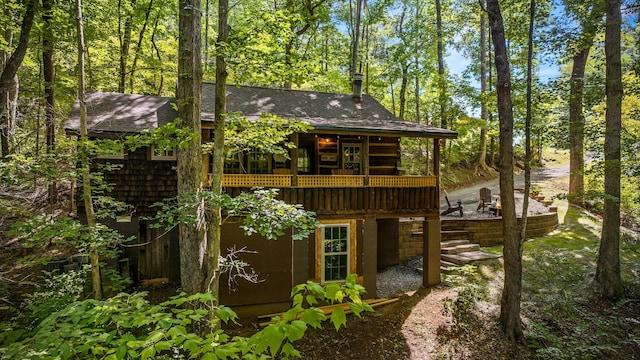 1131 Old Cartertown Rd, Gatlinburg, TN 37738 - rear view of house with a deck and roof with shingles