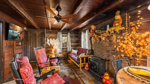 1131 Old Cartertown Rd, Gatlinburg, TN 37738 - sunroom / solarium featuring beamed ceiling and a wood stove