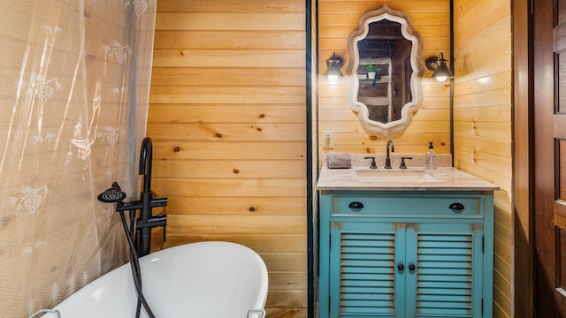 1131 Old Cartertown Rd, Gatlinburg, TN 37738 - full bathroom with wooden walls, a freestanding bath, and vanity
