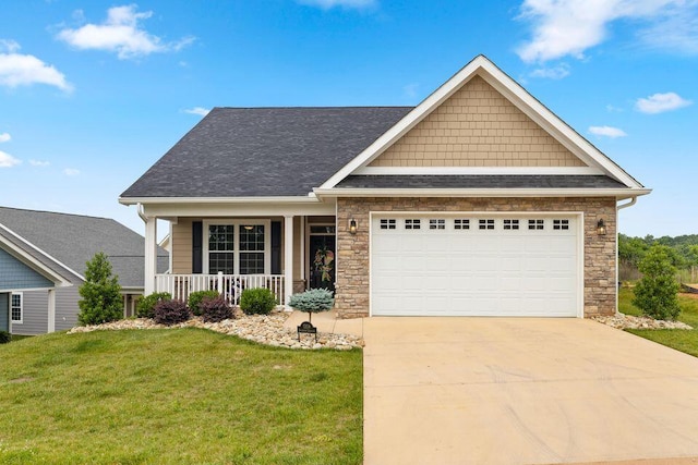 craftsman inspired home featuring a garage, concrete driveway, stone siding, a porch, and a front lawn