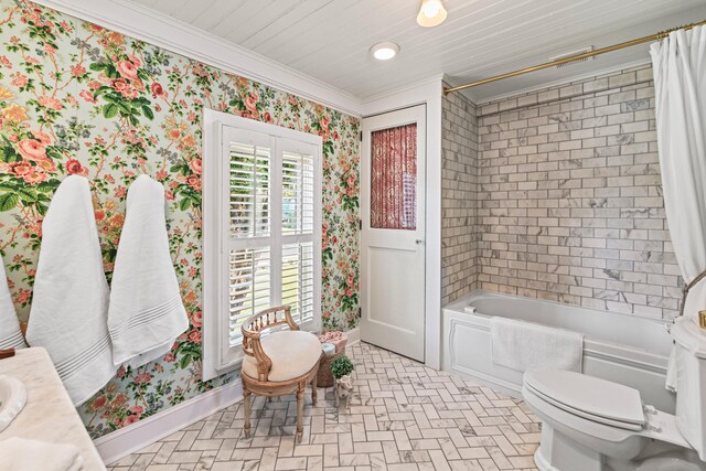 full bathroom featuring crown molding, shower / bath combo with shower curtain, vanity, and toilet