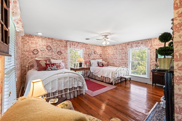 bedroom with wood-type flooring and ceiling fan