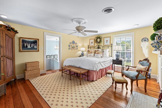 bedroom featuring hardwood / wood-style flooring and ceiling fan