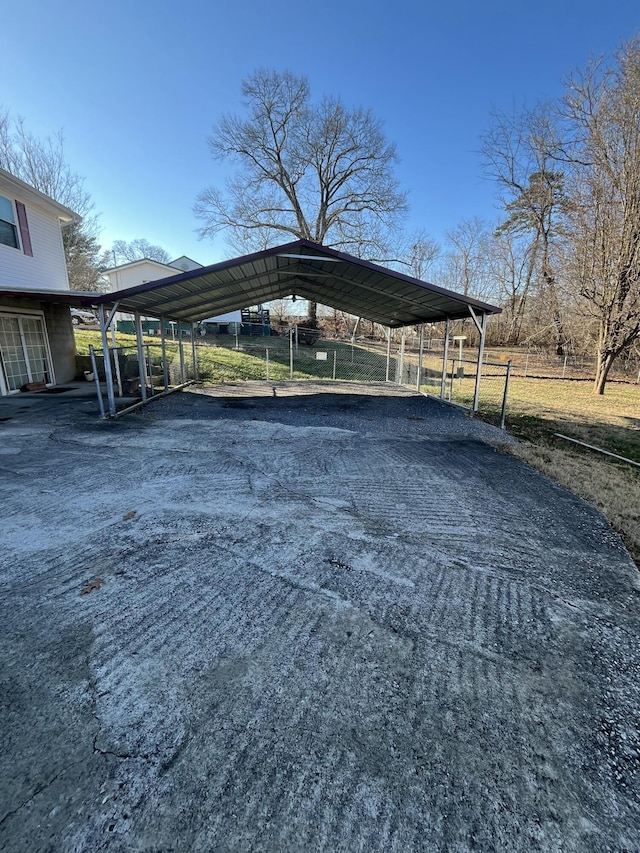 view of vehicle parking with a carport