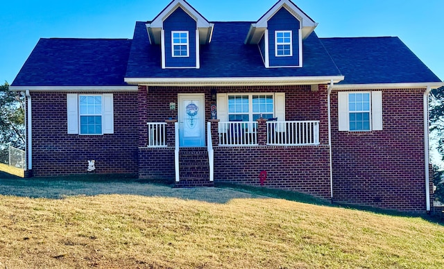 view of front facade with a front yard and a porch