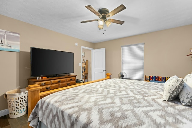 bedroom featuring ceiling fan and hardwood / wood-style flooring