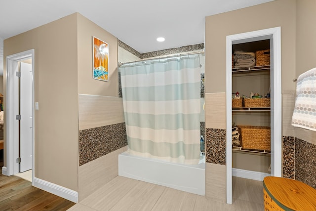 bathroom with shower / bathtub combination with curtain