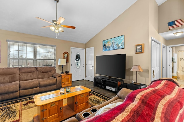 living room with dark wood-type flooring, high vaulted ceiling, and ceiling fan