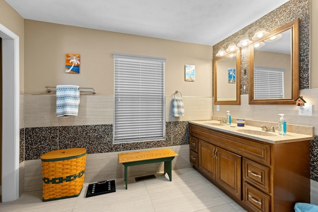 bathroom featuring tile walls, vanity, and tile patterned floors