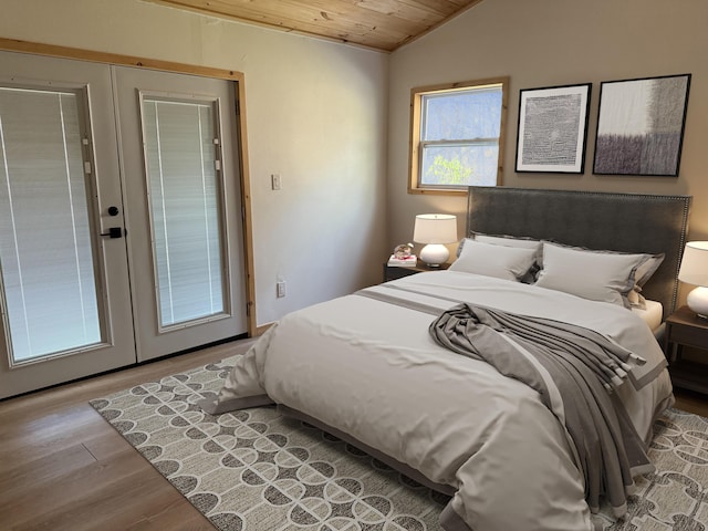 bedroom with vaulted ceiling, wood finished floors, wood ceiling, and french doors
