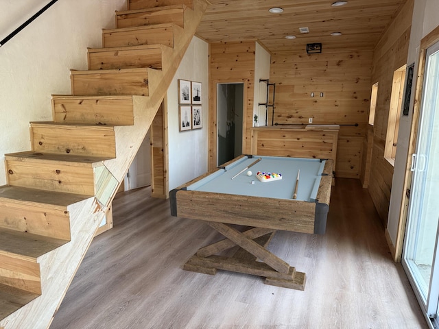 game room featuring wooden ceiling, wood walls, billiards, and wood finished floors