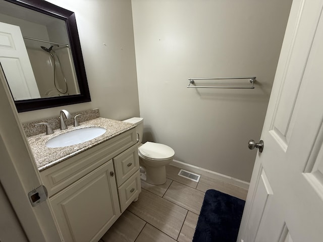 968 Cedar Trace Ln, Morristown, TN 37814 - bathroom with vanity, toilet, baseboards, and a shower