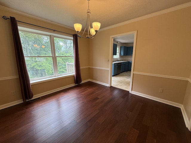 968 Cedar Trace Ln, Morristown, TN 37814 - empty room with a chandelier, a textured ceiling, dark wood-style flooring, ornamental molding, and baseboards