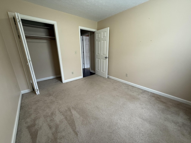 968 Cedar Trace Ln, Morristown, TN 37814 - unfurnished bedroom with carpet floors, baseboards, a closet, and a textured ceiling