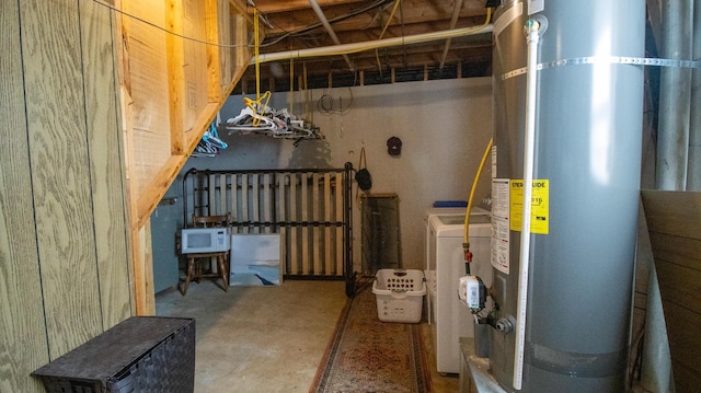 utility room with gas water heater and washer / clothes dryer