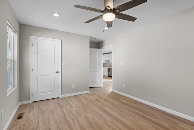 1002 Watercrest St, Morristown, TN 37814 - unfurnished bedroom with light wood-style floors, multiple windows, recessed lighting, and a ceiling fan