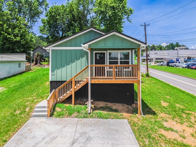 1002 Watercrest St, Morristown, TN 37814 - view of front of home with board and batten siding, a front lawn, and stairway