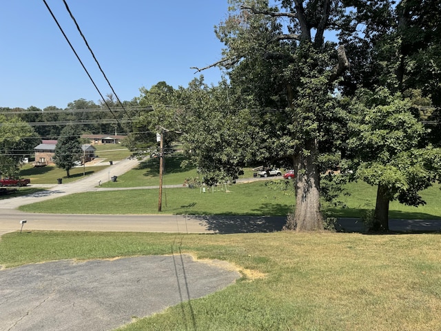 surrounding community featuring a yard