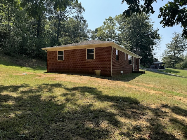 view of side of home featuring a yard