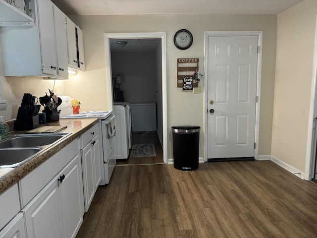 kitchen with dark hardwood / wood-style flooring, electric stove, white cabinetry, and sink