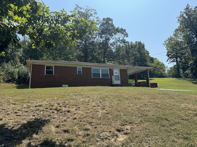 single story home with a carport and a front yard