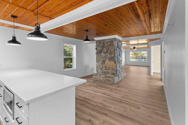 kitchen featuring light hardwood / wood-style flooring, white cabinets, wooden ceiling, and decorative light fixtures