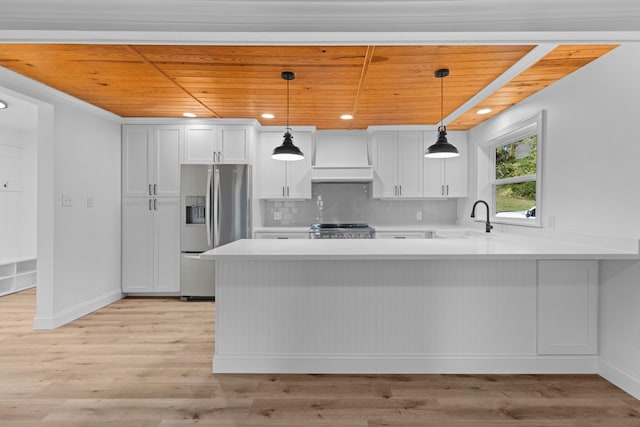 kitchen with custom range hood, white cabinets, wooden ceiling, and stainless steel refrigerator with ice dispenser