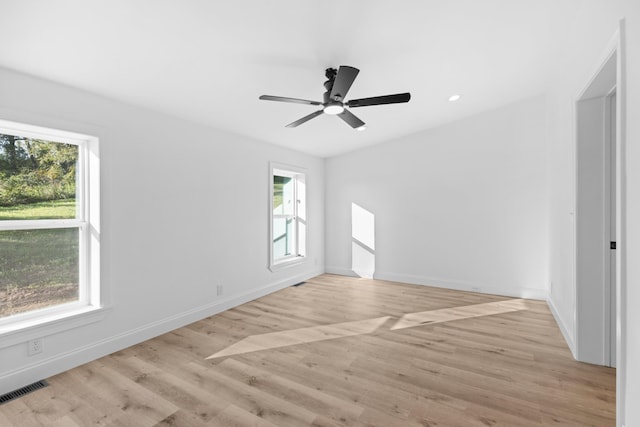 spare room with ceiling fan and light hardwood / wood-style flooring