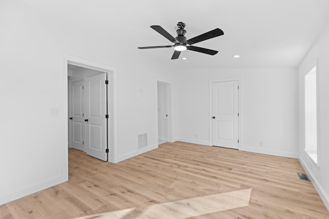 empty room featuring light hardwood / wood-style flooring, ceiling fan, and lofted ceiling